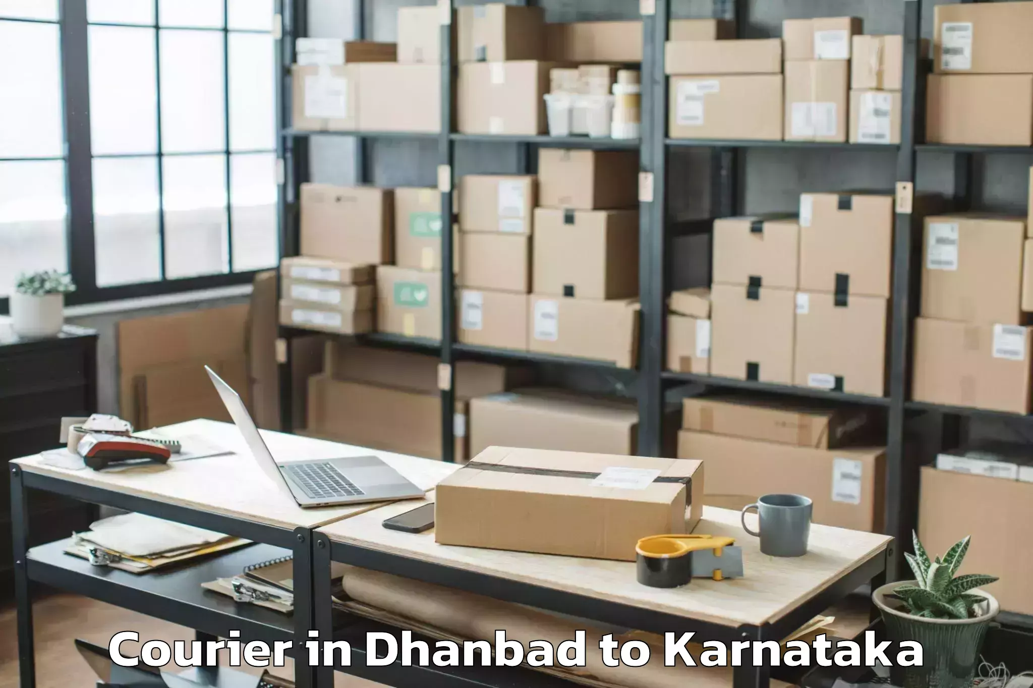 Get Dhanbad to Ponnampet Courier